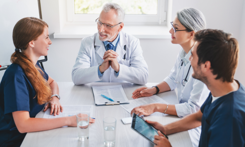 A captivating scene of seasoned medical professionals engaged in an ACLS algorithm masterclass
