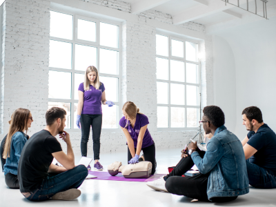 Participants practicing mindfulness techniques to manage stress during ACLS training.