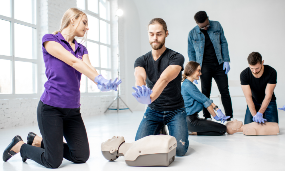 Employees undergoing CPR training to enhance workplace safety.