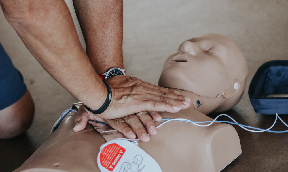 Layperson practicing CPR during an ACLS class.