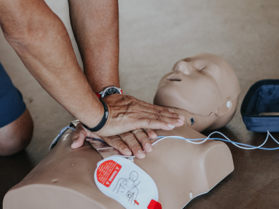 Layperson practicing CPR during an ACLS class.