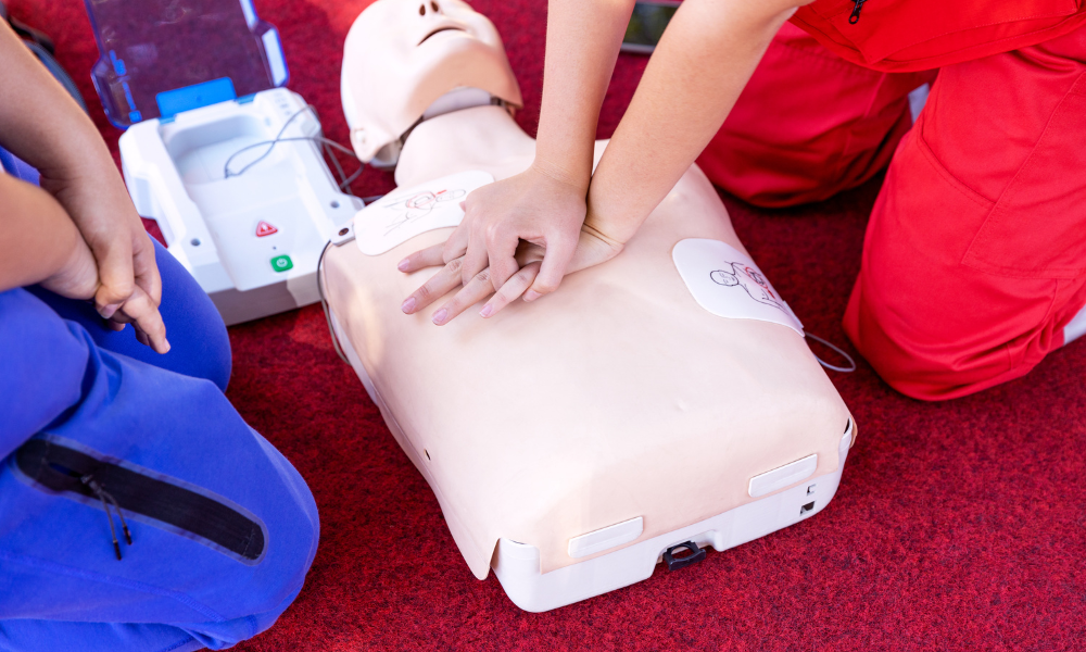Non-medical individuals engaged in ACLS training, practicing CPR techniques for emergency preparedness.