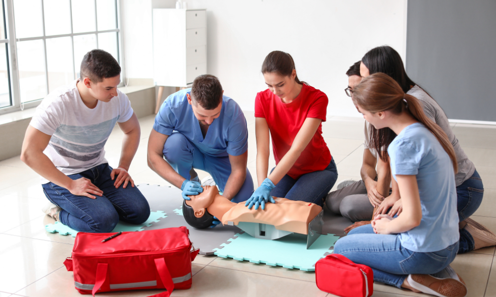 Dedicated ACLS instructor guiding healthcare professionals through hands-on training in cardiovascular emergency management.