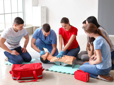 Dedicated ACLS instructor guiding healthcare professionals through hands-on training in cardiovascular emergency management.