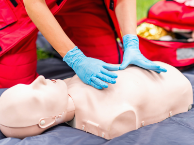 Healthcare professionals practicing ACLS Mega Codes in a simulated emergency scenario.