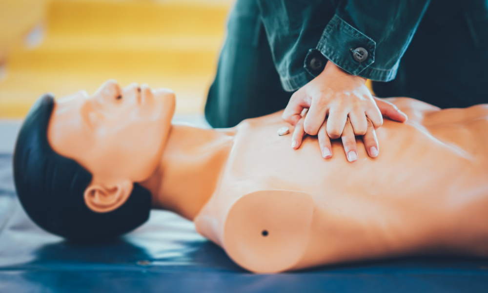 Healthcare professional administering ACLS medications with precision during an emergency.