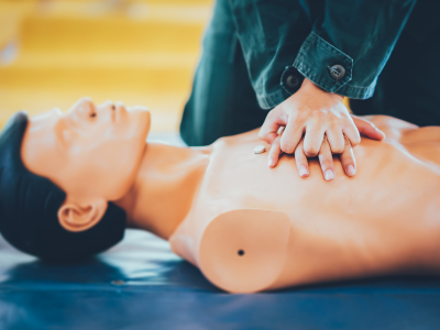 Healthcare professional administering ACLS medications with precision during an emergency.