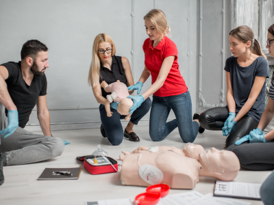 A physician confidently leading a team in a simulated cardiovascular emergency, showcasing the essential role of ACLS certification in emergency response.