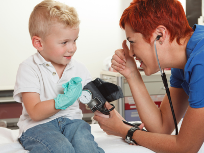 Healthcare provider administering medication to a pediatric patient.