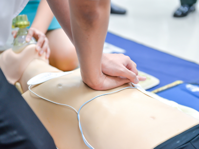 Healthcare professional making strategic decisions in a simulated ACLS scenario.