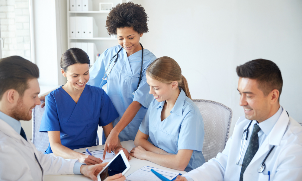 Healthcare professionals discussing ethical considerations in ACLS decision-making
