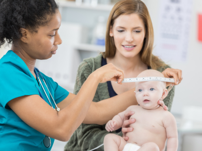 Healthcare provider assessing a pediatric patient.