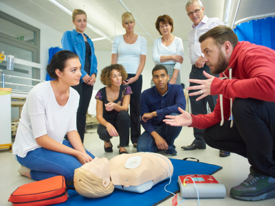 Healthcare professionals actively participating in realistic ACLS simulations, enhancing their practical skills through interactive learning.