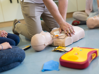 AED device with clear prompts for effective use in cardiac emergencies.