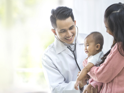 Confident provider offering pediatric care.