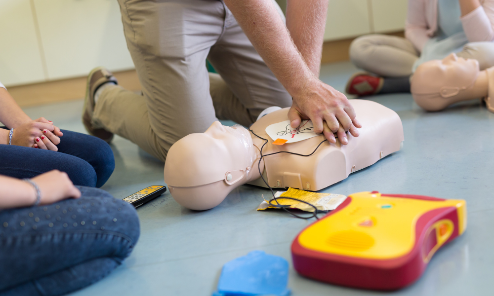 Healthcare providers participating in hands-on training exercises with ACLS equipment, underlining the importance of competence in equipment use.