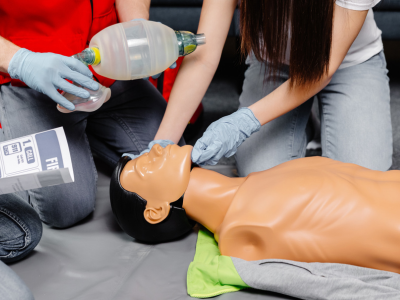A dedicated healthcare professional demonstrating precise CPR techniques during intensive ACLS training.