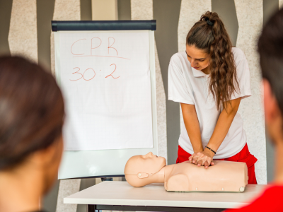 A dedicated healthcare professional demonstrating the proper technique for chest compressions, a fundamental element of high-quality CPR.