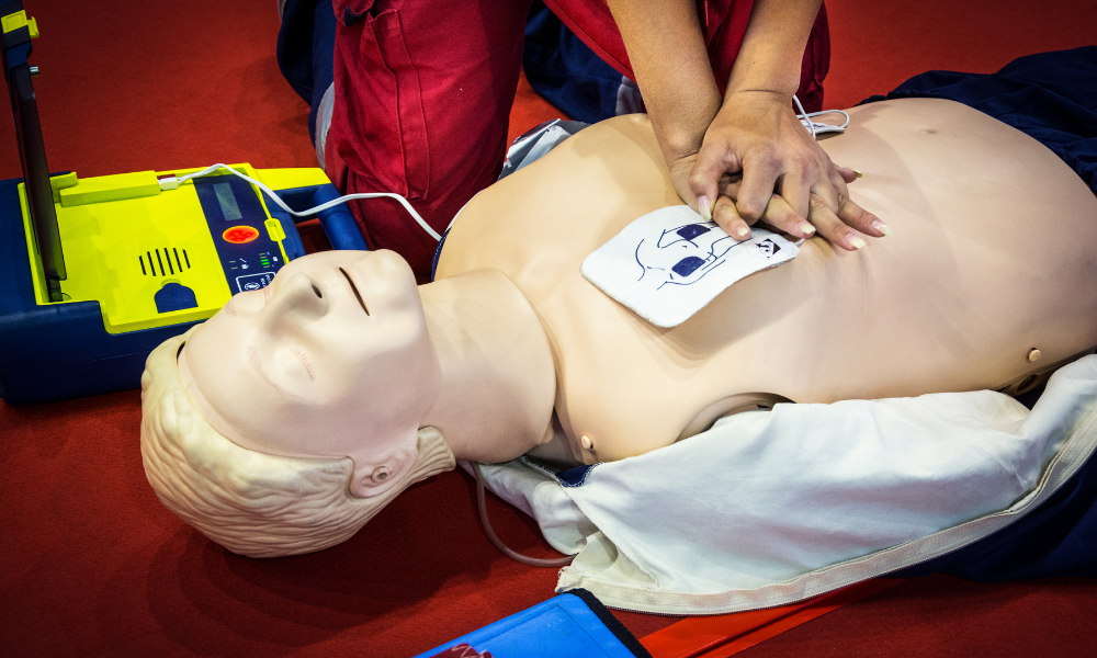 Healthcare professionals actively participating in a realistic ACLS simulation, enhancing their emergency response skills.