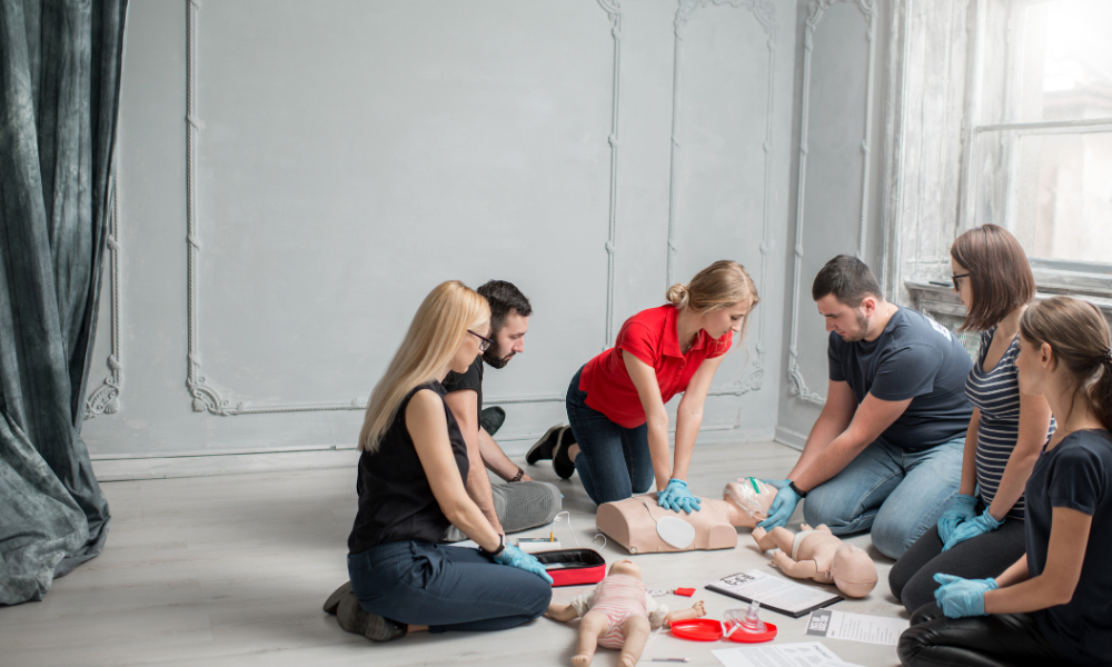 Healthcare professionals collaborating in a simulated ACLS scenario, demonstrating effective teamwork.