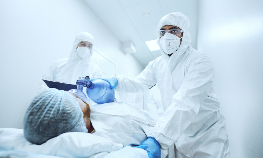 Healthcare provider examining a patient experiencing a cardiac emergency